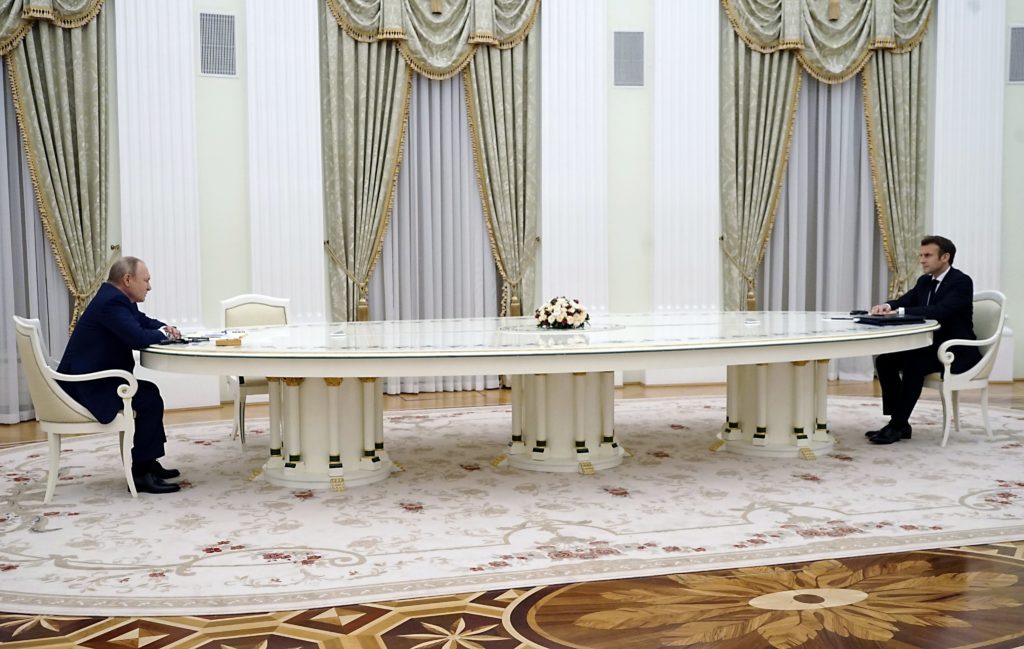 Putin and Macron meeting with a large table.jpg - Wikimedia Commons